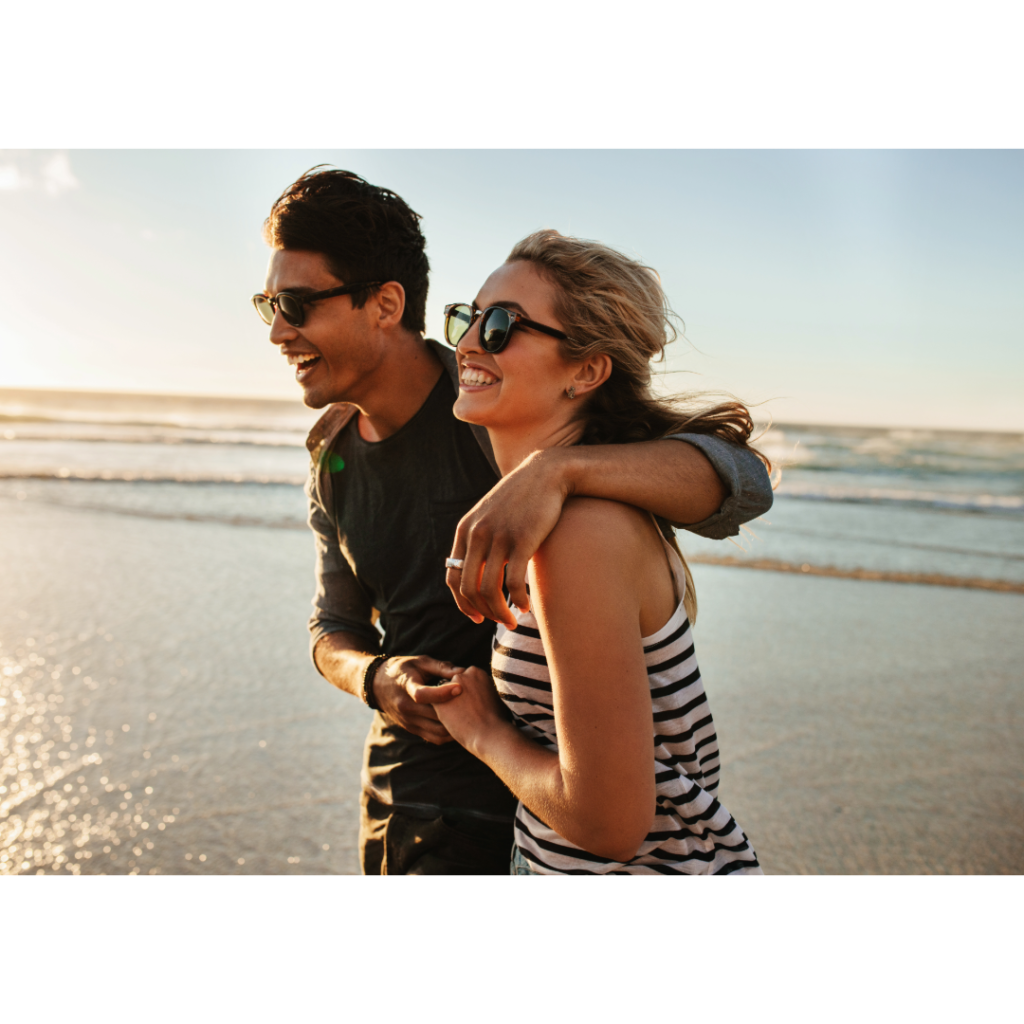 Couple laughing on beach after taking thcDR products